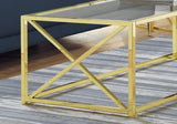 44" Clear And Gold Glass And Iron Coffee Table