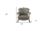 45" Ivory Faux Leather And Gold Patina Ornate Arm Chair
