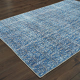 5' X 8' Blue And Brown Floral Power Loom Stain Resistant Area Rug