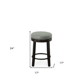 Set of Two 24" Cream And Espresso Faux Leather And Solid Wood Swivel Backless Counter Height Bar Chairs