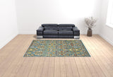 9' x 12' Teal and Gold Floral Power Loom Area Rug