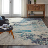 10' x 14' Ivory Abstract Power Loom Area Rug