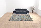 9' x 12' Orange and Ivory Floral Power Loom Area Rug