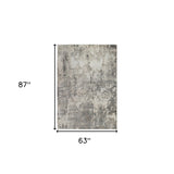 9' x 12' Gray and Beige Abstract Power Loom Area Rug