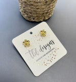 Golden floral studs